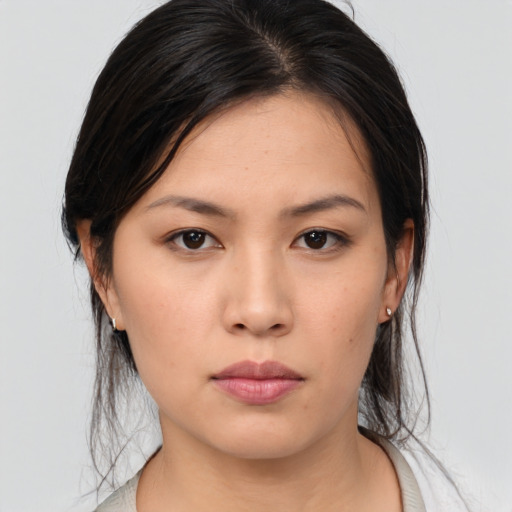 Neutral asian young-adult female with medium  brown hair and brown eyes