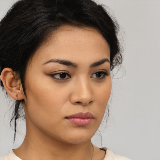 Neutral latino young-adult female with medium  brown hair and brown eyes