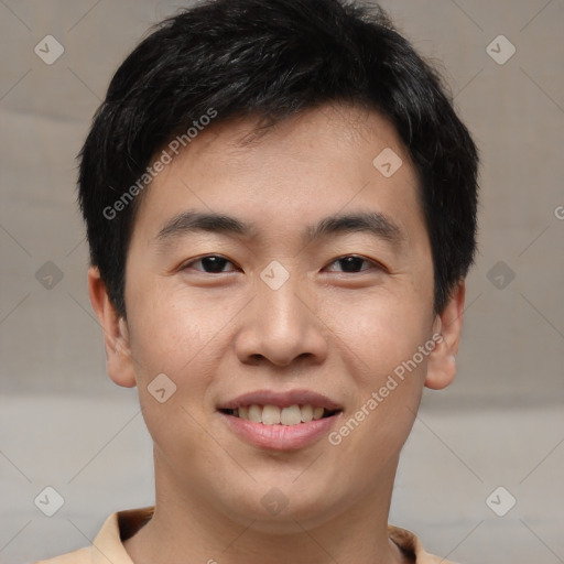 Joyful asian young-adult male with short  brown hair and brown eyes