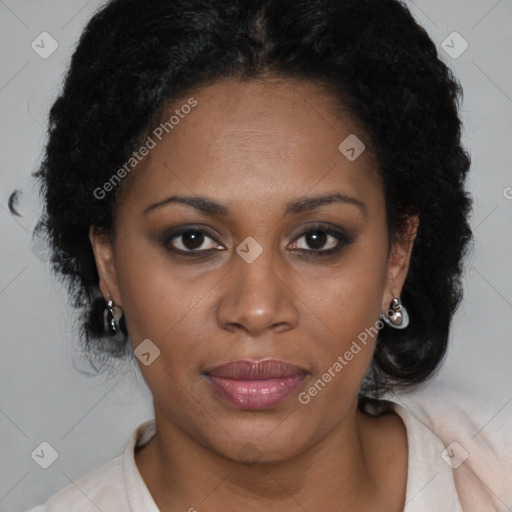 Joyful black adult female with medium  brown hair and brown eyes