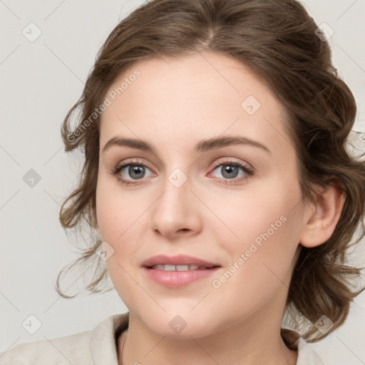 Joyful white young-adult female with medium  brown hair and blue eyes