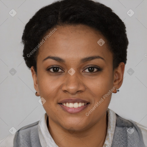 Joyful black young-adult female with short  brown hair and brown eyes