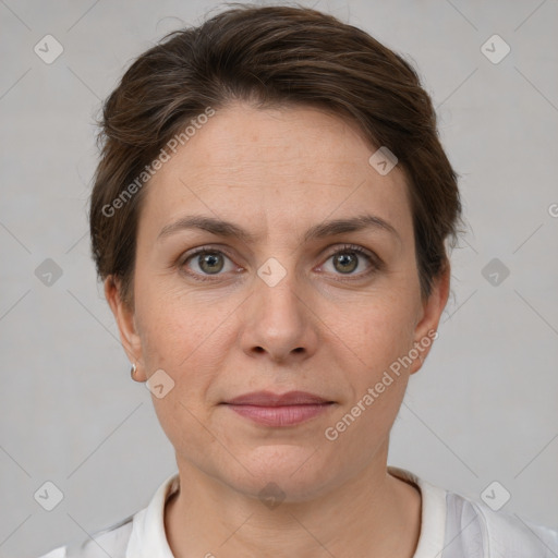 Joyful white adult female with short  brown hair and grey eyes