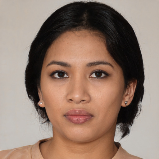Neutral latino young-adult female with medium  black hair and brown eyes
