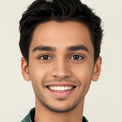 Joyful white young-adult male with short  black hair and brown eyes