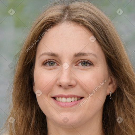 Joyful white young-adult female with long  brown hair and green eyes