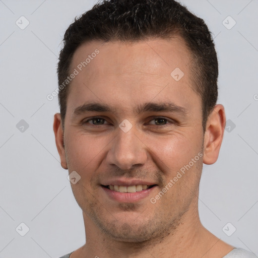 Joyful white young-adult male with short  brown hair and brown eyes