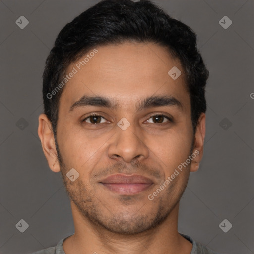 Joyful latino young-adult male with short  brown hair and brown eyes