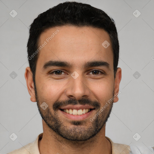 Joyful white young-adult male with short  black hair and brown eyes