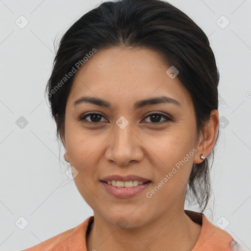 Joyful latino young-adult female with medium  brown hair and brown eyes