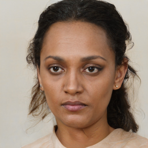 Neutral black young-adult female with medium  brown hair and brown eyes