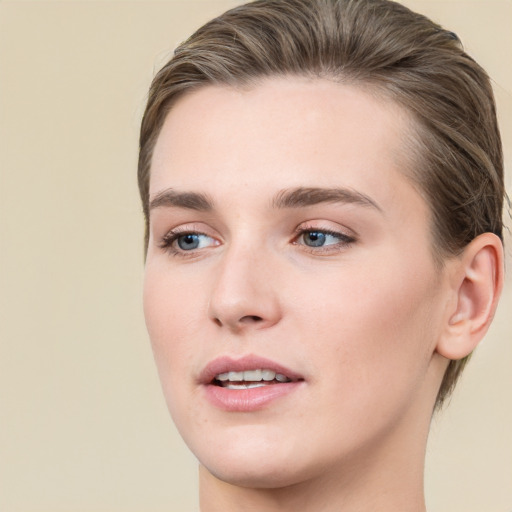 Joyful white young-adult female with medium  brown hair and grey eyes