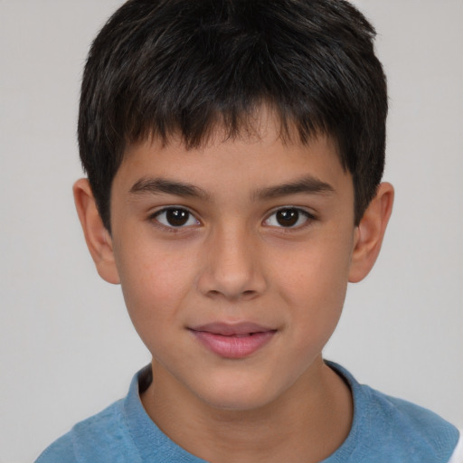 Joyful white child male with short  brown hair and brown eyes