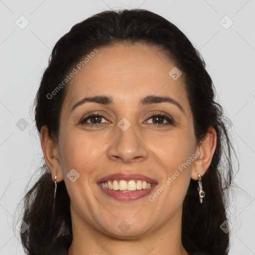 Joyful white adult female with long  brown hair and brown eyes