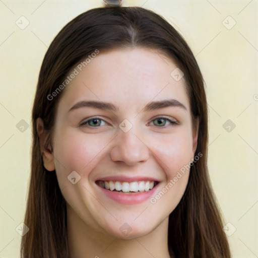 Joyful white young-adult female with long  brown hair and brown eyes