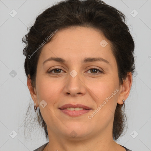 Joyful white adult female with short  brown hair and brown eyes