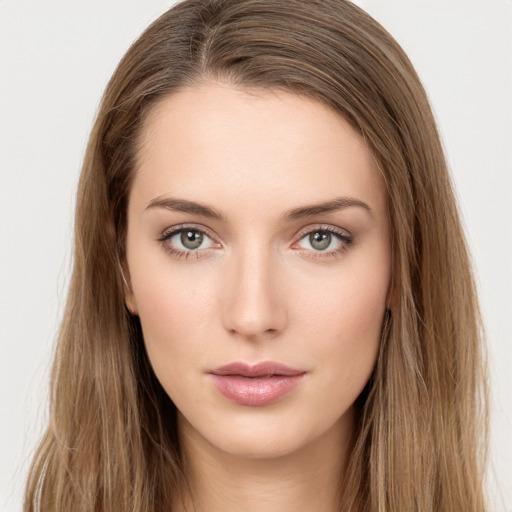 Neutral white young-adult female with long  brown hair and brown eyes