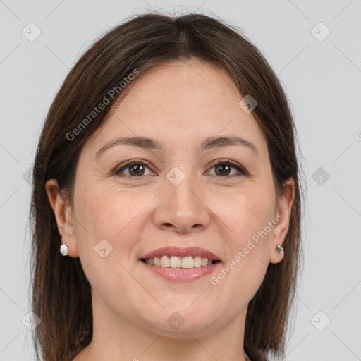 Joyful white adult female with medium  brown hair and brown eyes