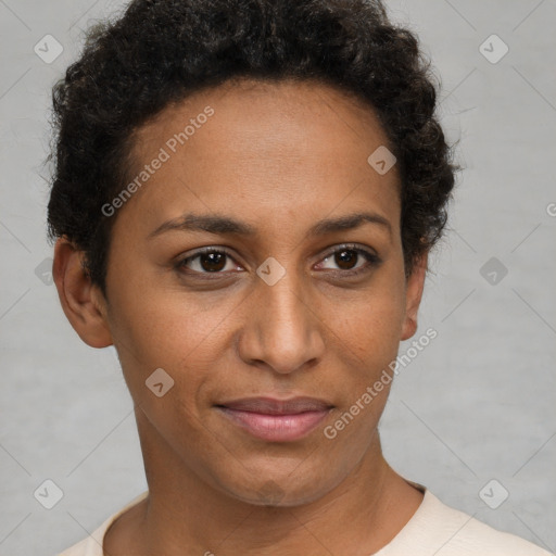 Joyful black young-adult female with short  brown hair and brown eyes