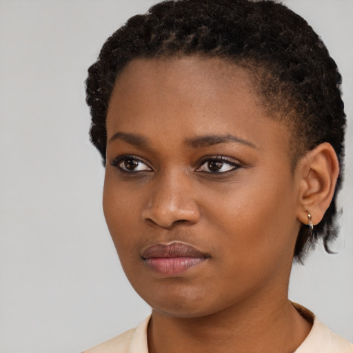 Neutral black young-adult female with short  black hair and brown eyes