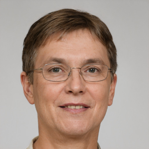 Joyful white adult male with short  brown hair and grey eyes