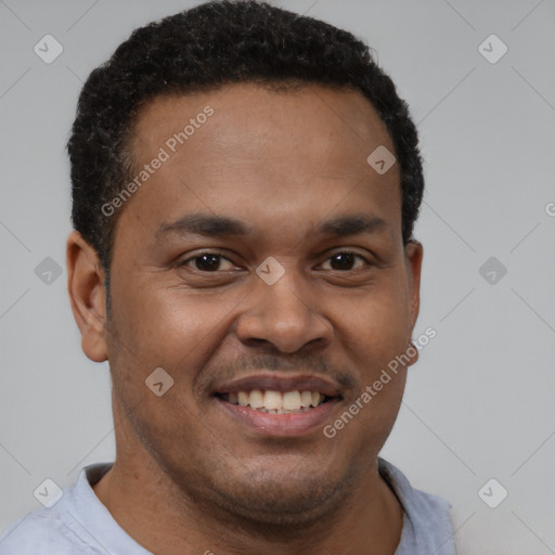 Joyful latino young-adult male with short  brown hair and brown eyes