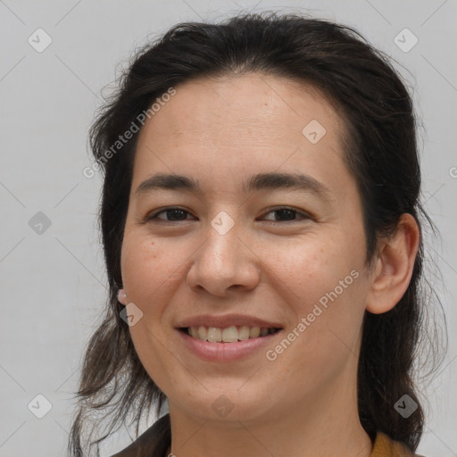 Joyful white young-adult female with medium  brown hair and brown eyes