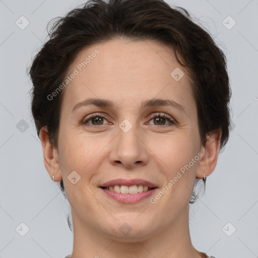 Joyful white adult female with short  brown hair and brown eyes