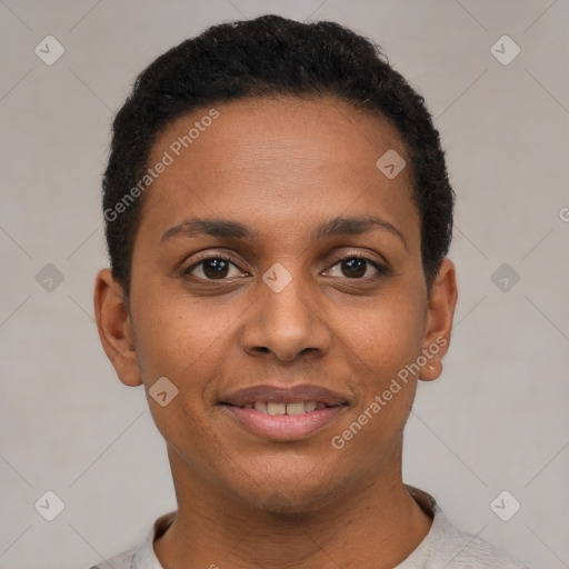 Joyful black young-adult female with short  black hair and brown eyes