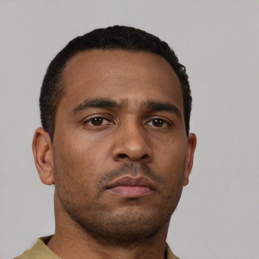 Neutral black young-adult male with short  brown hair and brown eyes