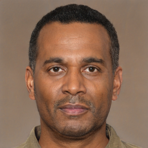 Neutral latino adult male with short  black hair and brown eyes