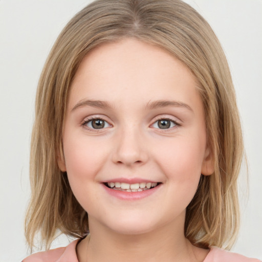 Joyful white child female with medium  brown hair and brown eyes