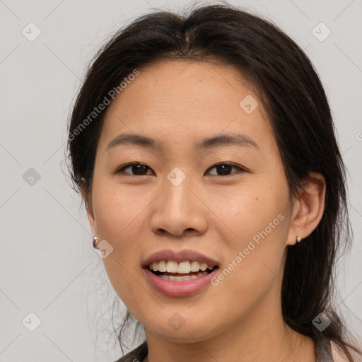 Joyful asian young-adult female with medium  brown hair and brown eyes