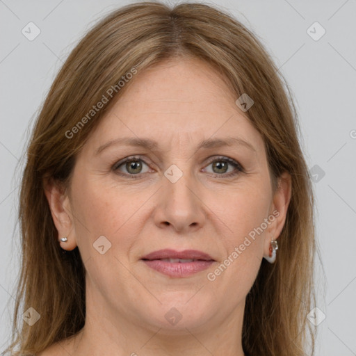 Joyful white adult female with medium  brown hair and grey eyes