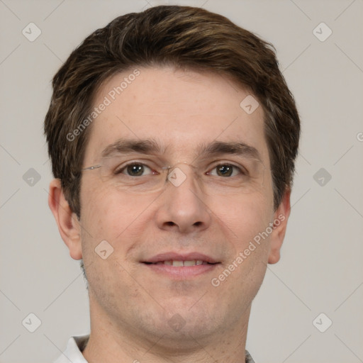 Joyful white adult male with short  brown hair and grey eyes