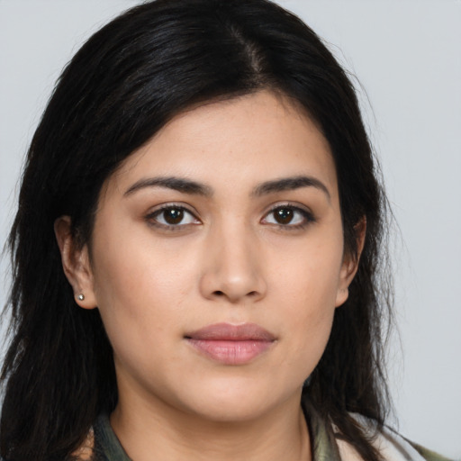 Joyful asian young-adult female with long  brown hair and brown eyes
