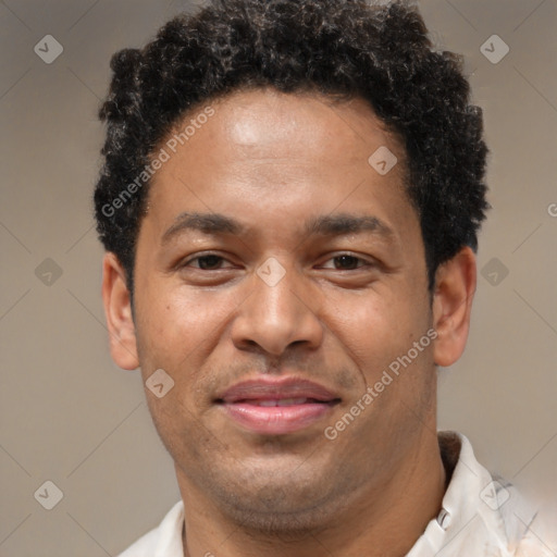 Joyful latino young-adult male with short  brown hair and brown eyes