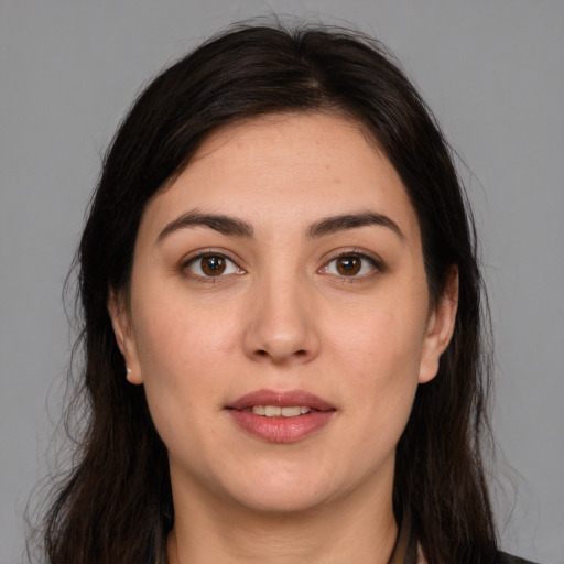 Joyful white young-adult female with medium  brown hair and brown eyes