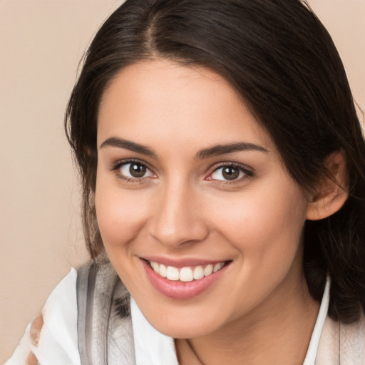 Joyful white young-adult female with medium  brown hair and brown eyes