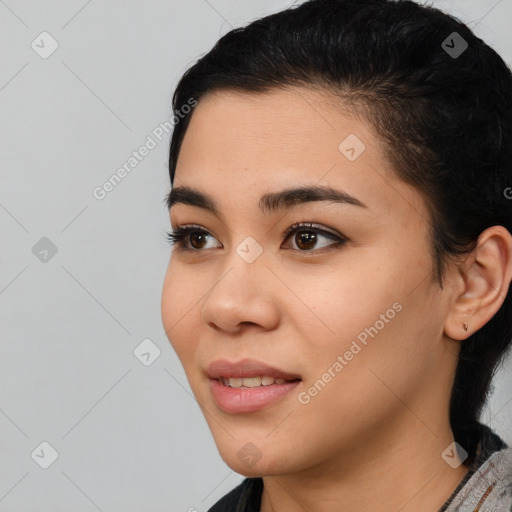 Joyful latino young-adult female with short  black hair and brown eyes