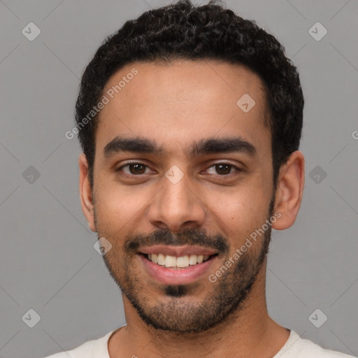 Joyful latino young-adult male with short  black hair and brown eyes