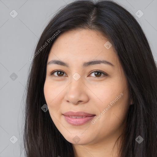 Joyful latino young-adult female with long  brown hair and brown eyes