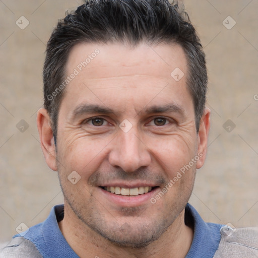 Joyful white adult male with short  brown hair and brown eyes