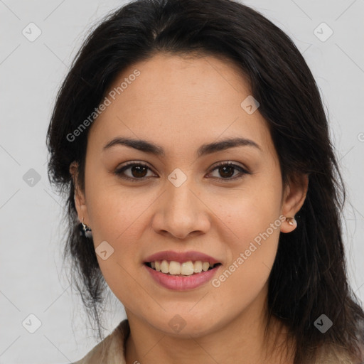 Joyful latino young-adult female with long  brown hair and brown eyes