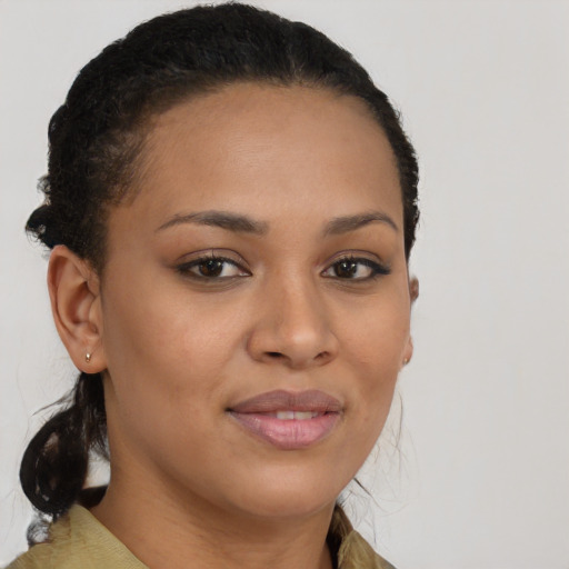 Joyful black young-adult female with medium  brown hair and brown eyes