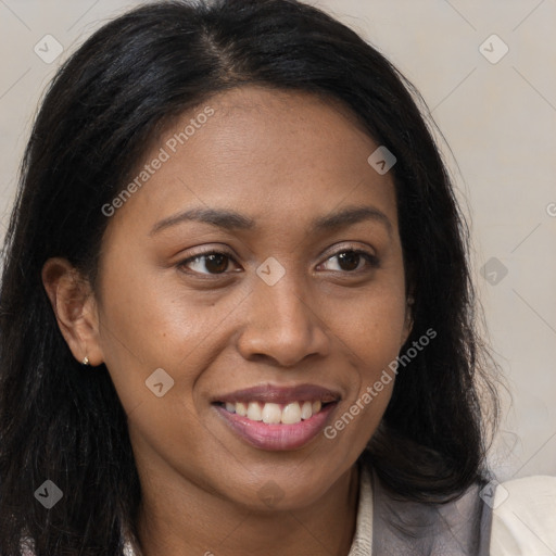 Joyful latino young-adult female with long  brown hair and brown eyes