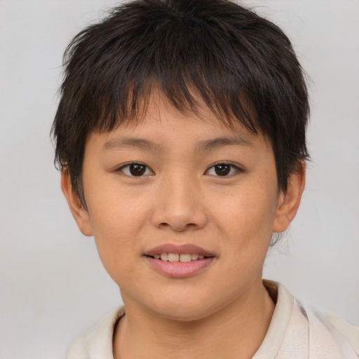 Joyful white child female with short  brown hair and brown eyes