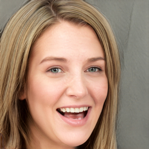 Joyful white young-adult female with long  brown hair and green eyes