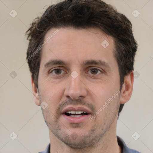 Joyful white adult male with short  brown hair and brown eyes