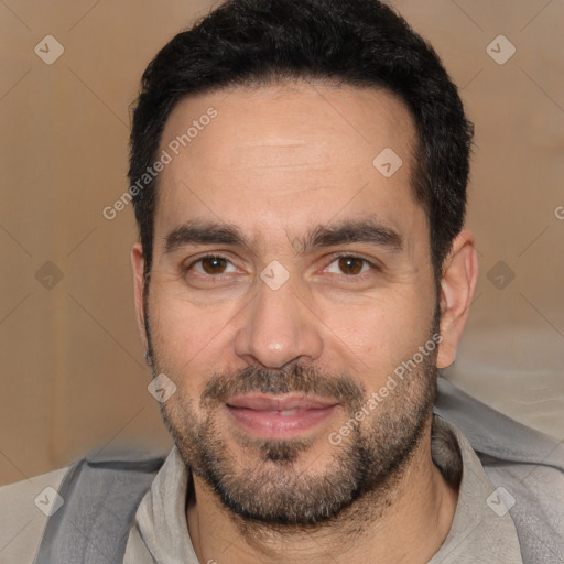 Joyful white adult male with short  black hair and brown eyes